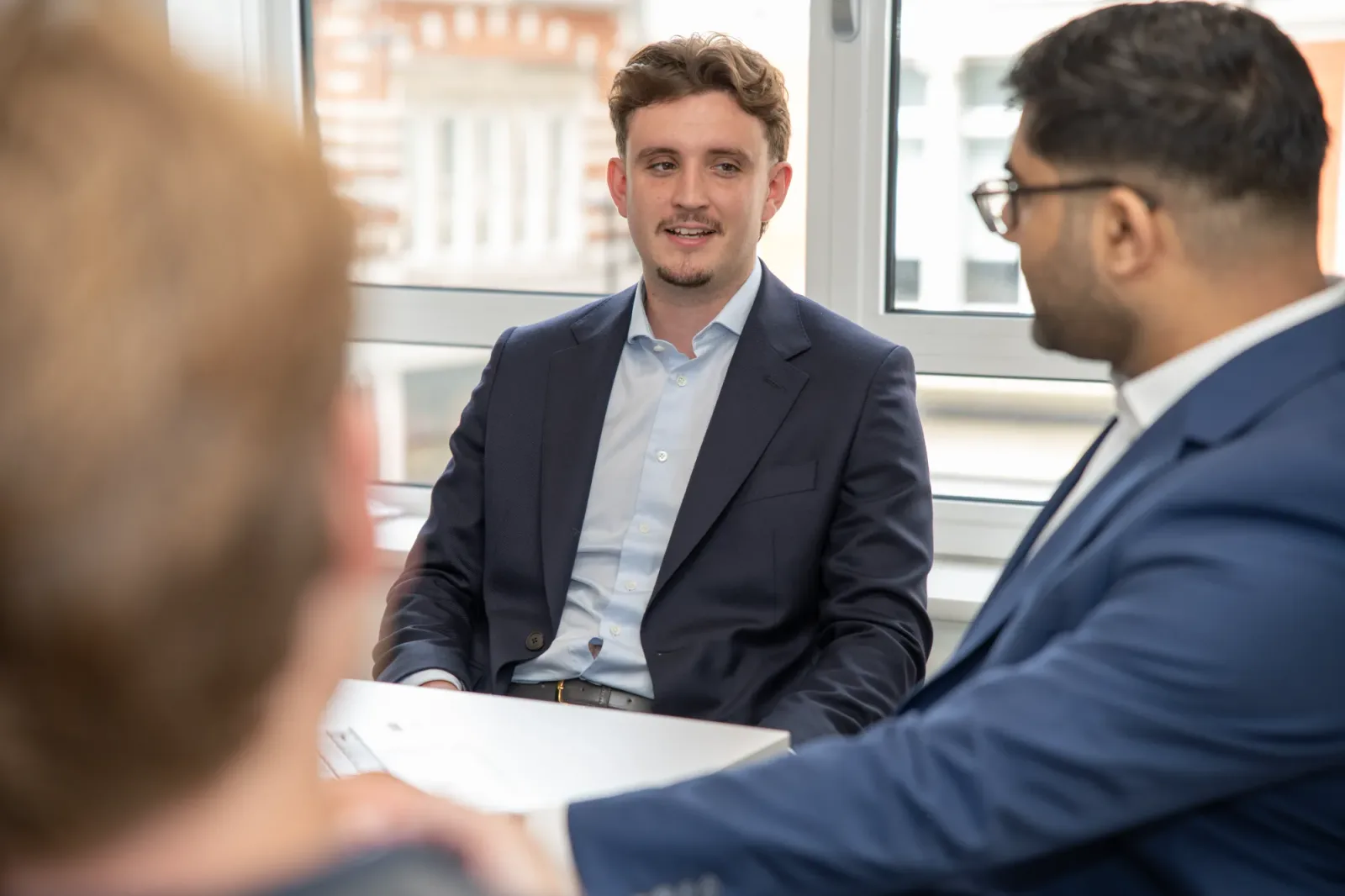 Binary Capital colleagues in a boardroom conversation