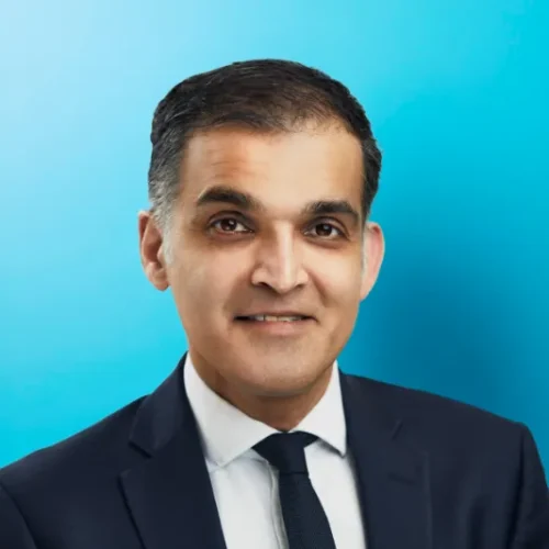 Professional man in suit with blue background.